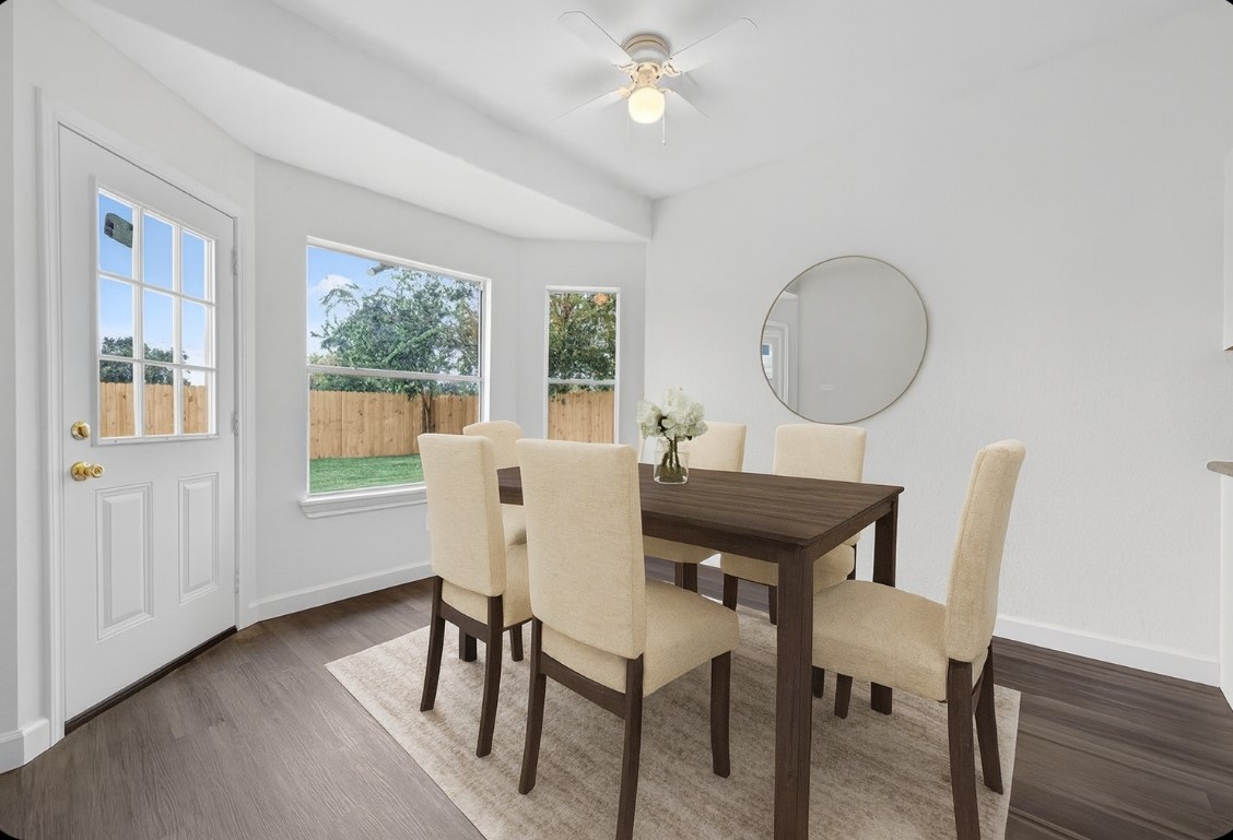 3322 Brackenfern Road Katy, TX 77449 - Photo 13 of 38 a view of a dining room with furniture window and wooden floor