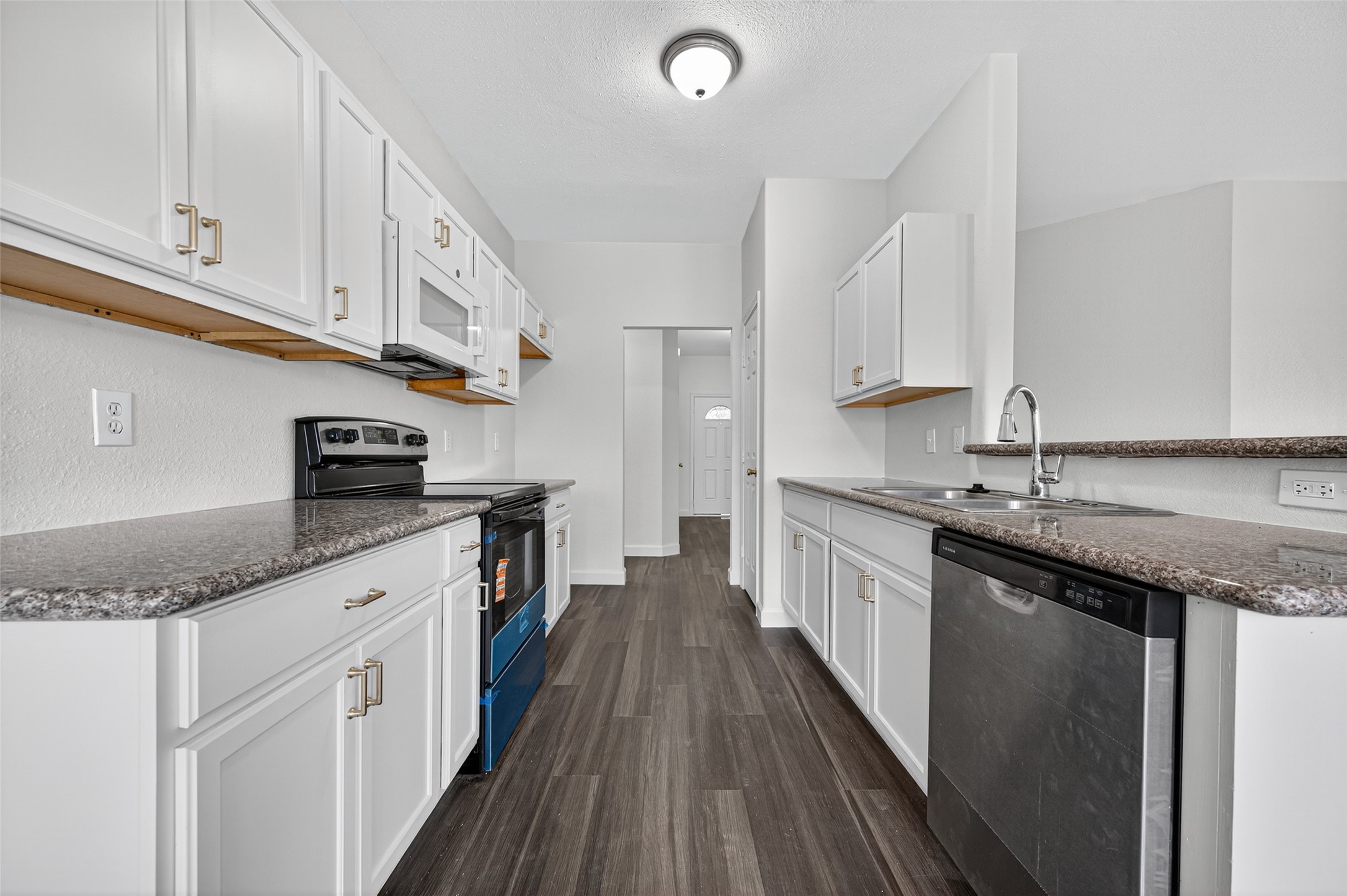 3322 Brackenfern Road Katy, TX 77449 - Photo 15 of 38 a kitchen with granite countertop lots of counter top space and stainless steel appliances