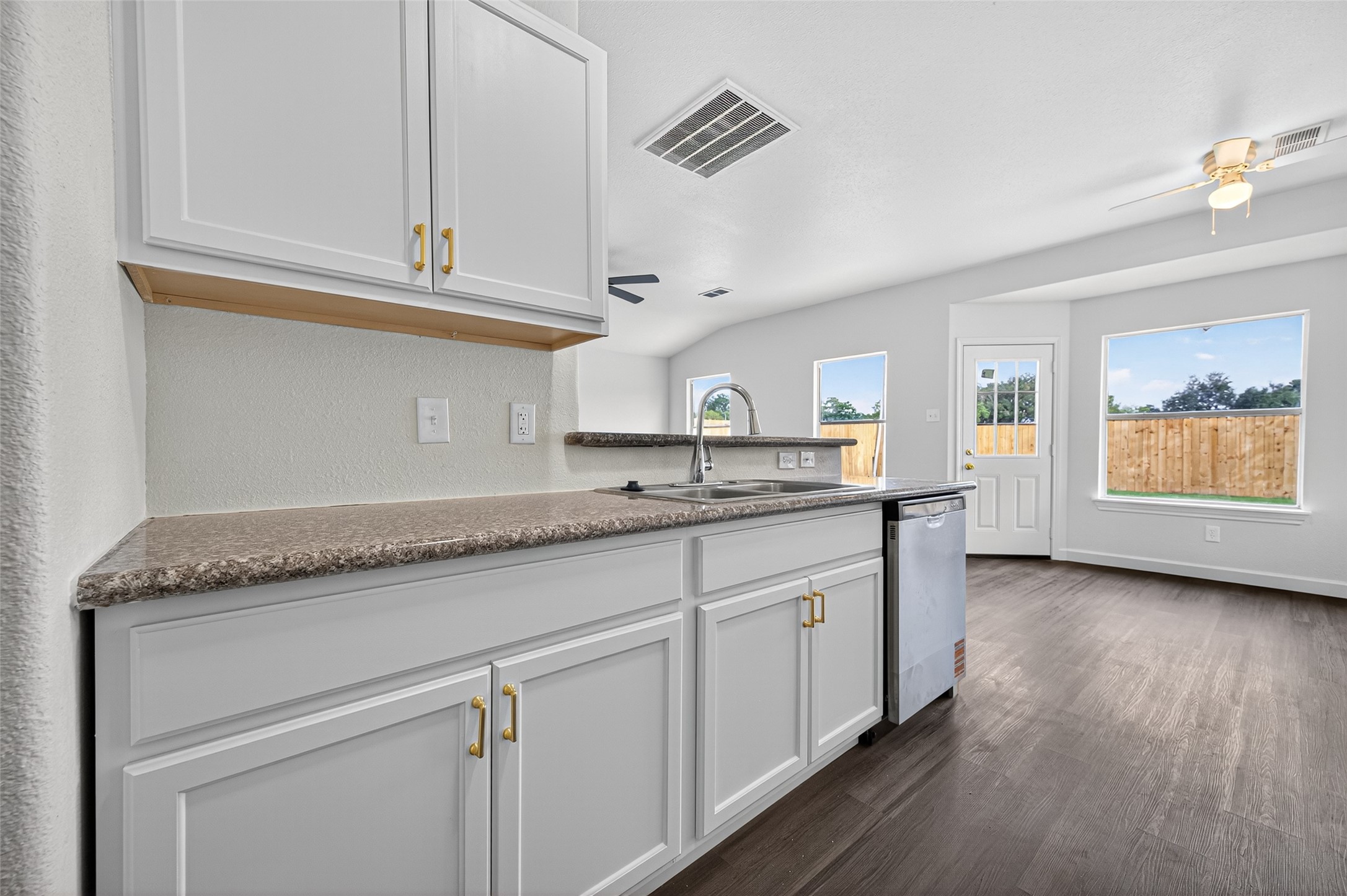 3322 Brackenfern Road Katy, TX 77449 - Photo 16 of 38 a kitchen with granite countertop stainless steel appliances white cabinets and a granite counter tops