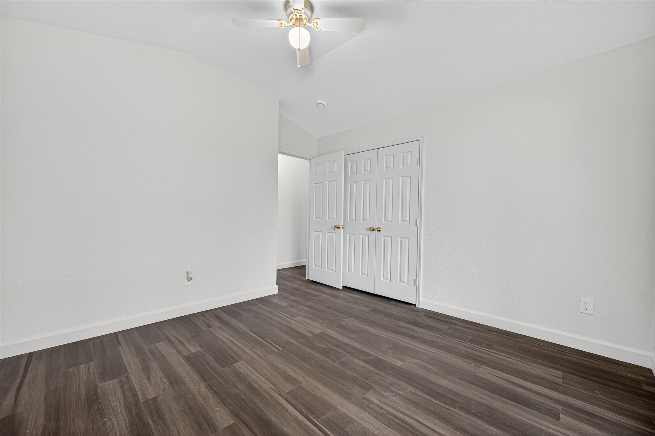 3322 Brackenfern Road Katy, TX 77449 - Photo 21 of 38 a view of an empty room with wooden floor