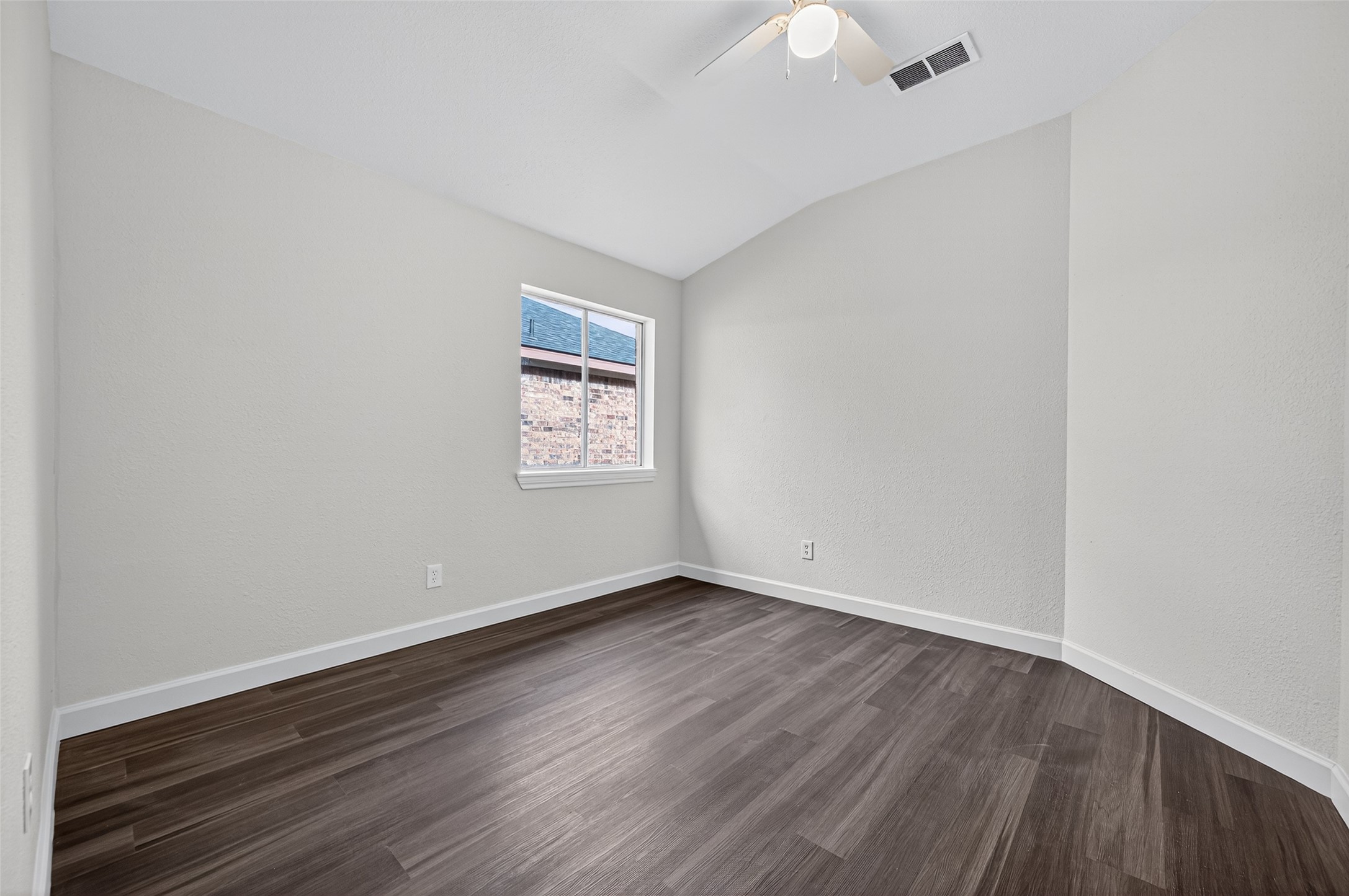 3322 Brackenfern Road Katy, TX 77449 - Photo 22 of 38 an empty room with wooden floor and windows