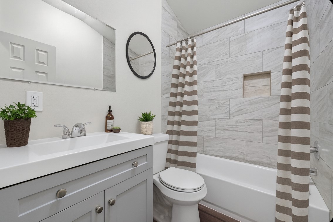 3322 Brackenfern Road Katy, TX 77449 - Photo 23 of 38 a bathroom with a sink toilet and shower