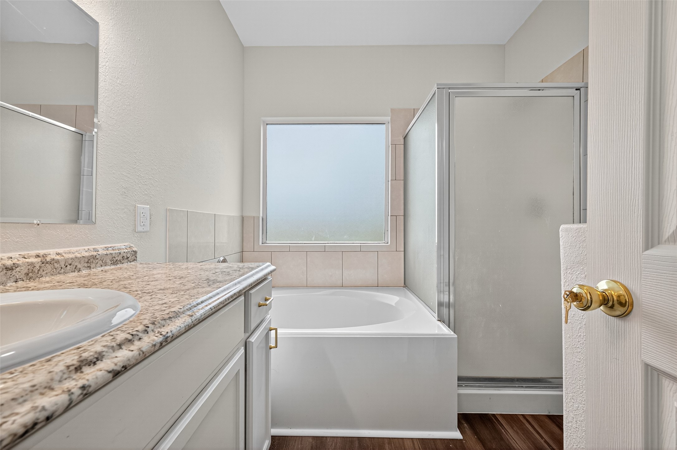 3322 Brackenfern Road Katy, TX 77449 - Photo 25 of 38 a bathroom with a granite countertop sink and a mirror