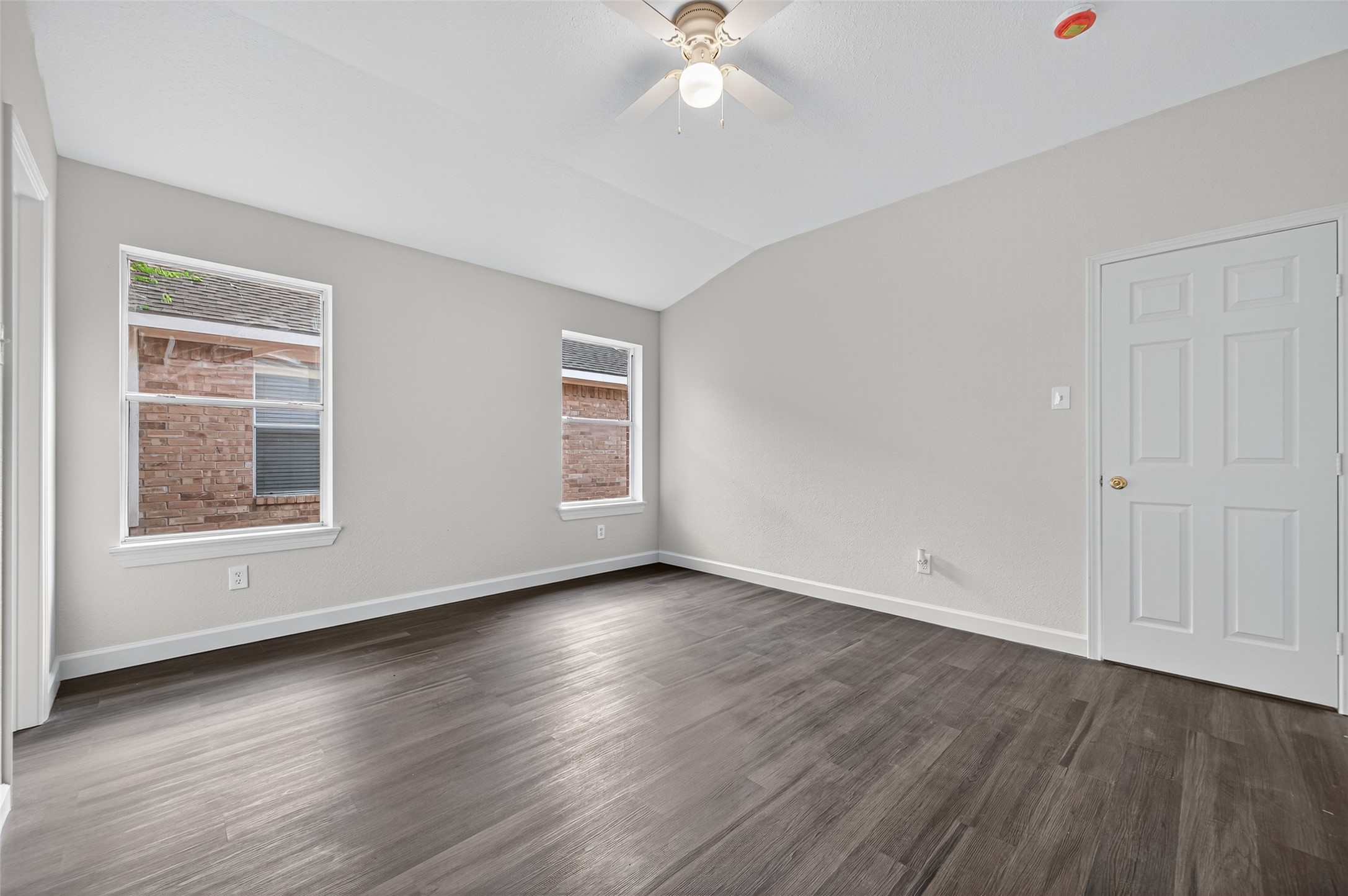 3322 Brackenfern Road Katy, TX 77449 - Photo 27 of 38 an empty room with wooden floor and windows