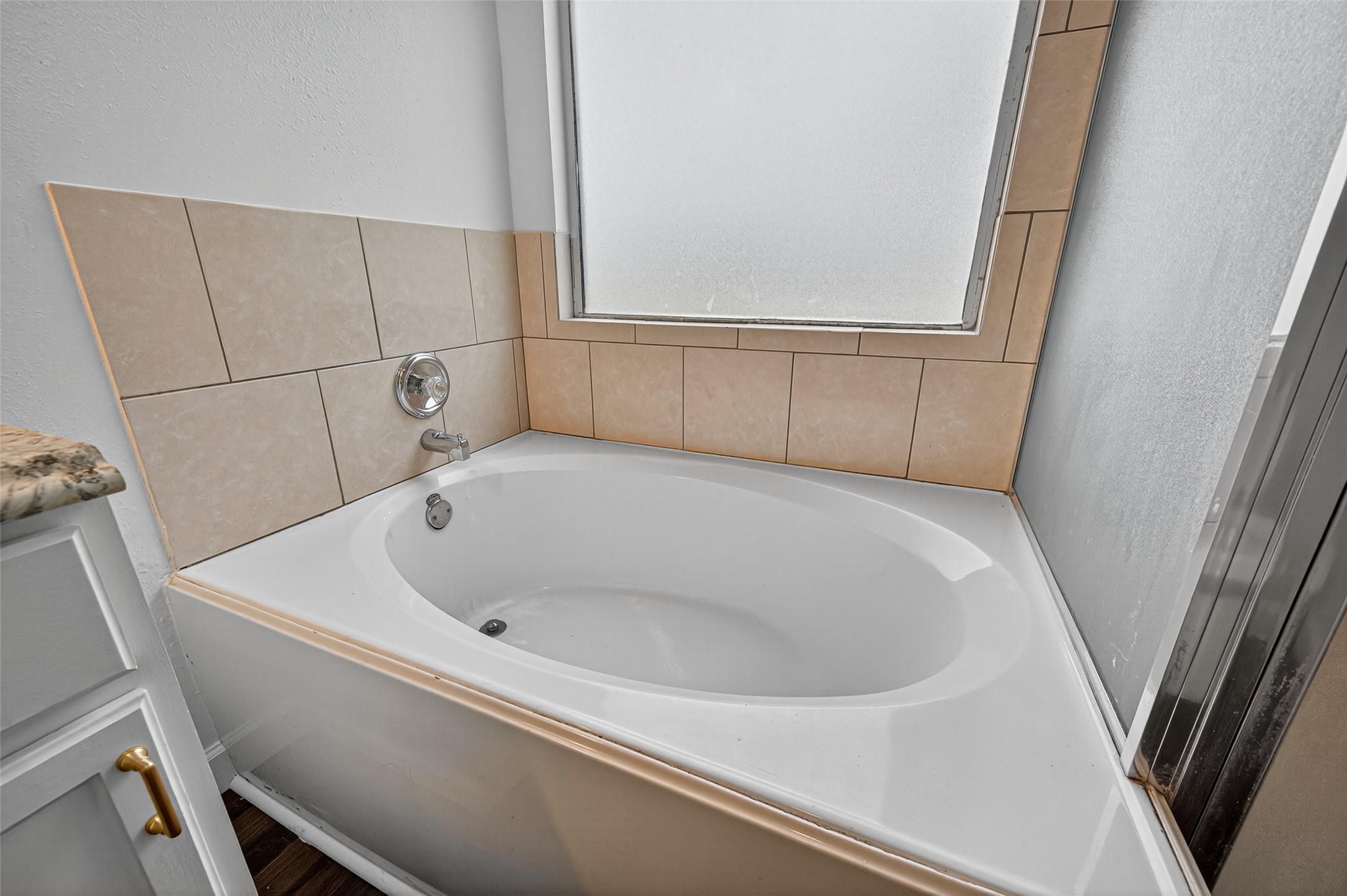 3322 Brackenfern Road Katy, TX 77449 - Photo 30 of 38 a bathroom with a tub and sink