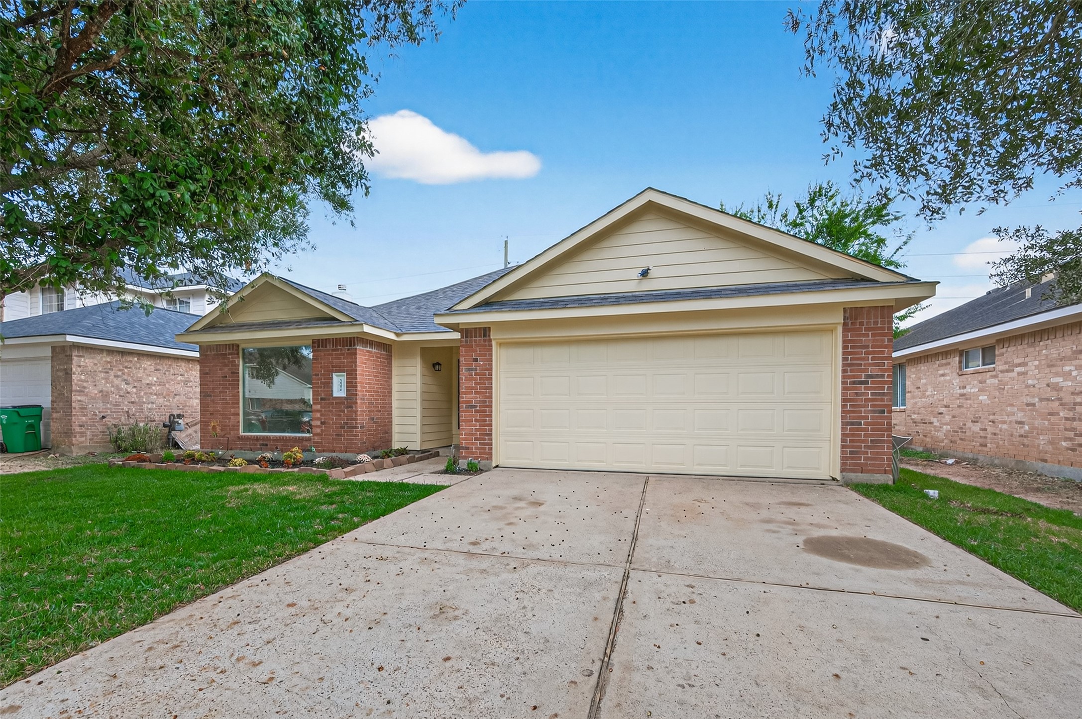 3322 Brackenfern Road Katy, TX 77449 - Photo 3 of 38 a front view of a house with a yard and garage