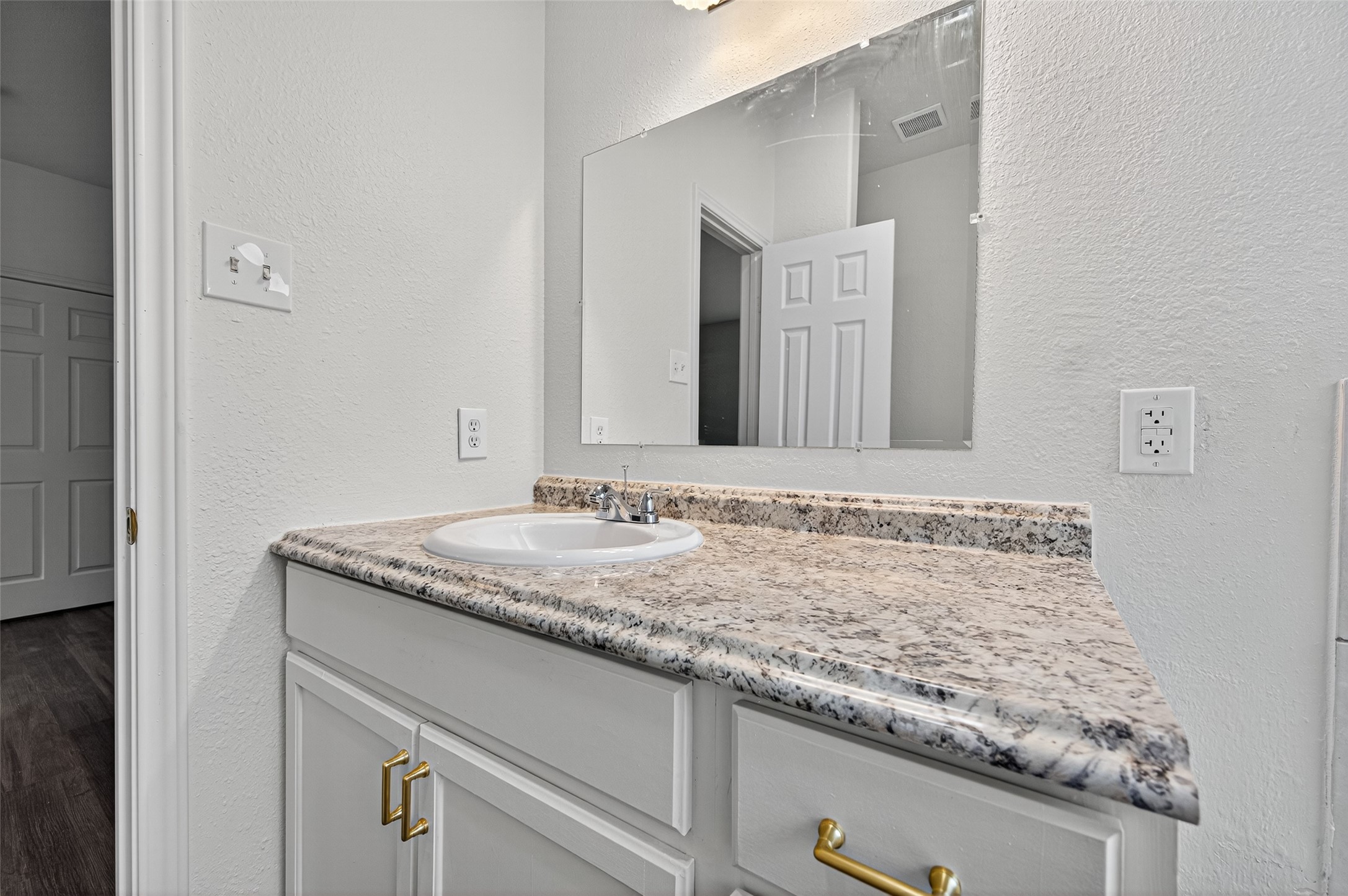 3322 Brackenfern Road Katy, TX 77449 - Photo 31 of 38 a bathroom with a granite countertop sink and a mirror