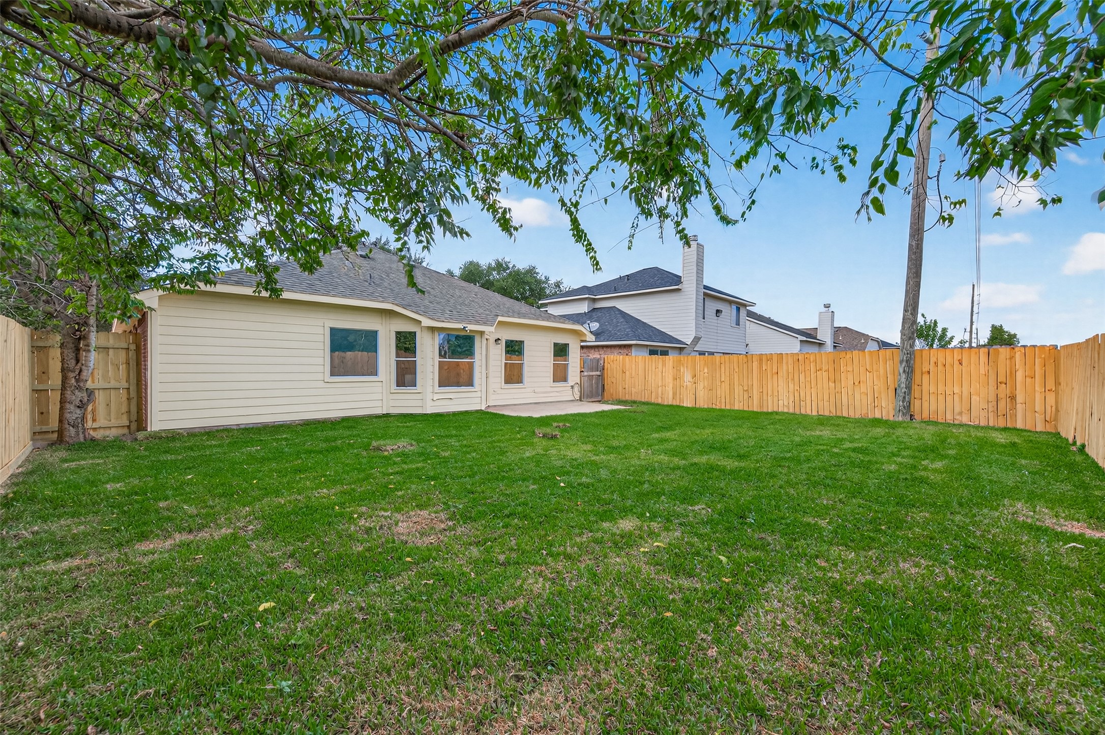 3322 Brackenfern Road Katy, TX 77449 - Photo 4 of 38 a front view of a house with a garden and yard