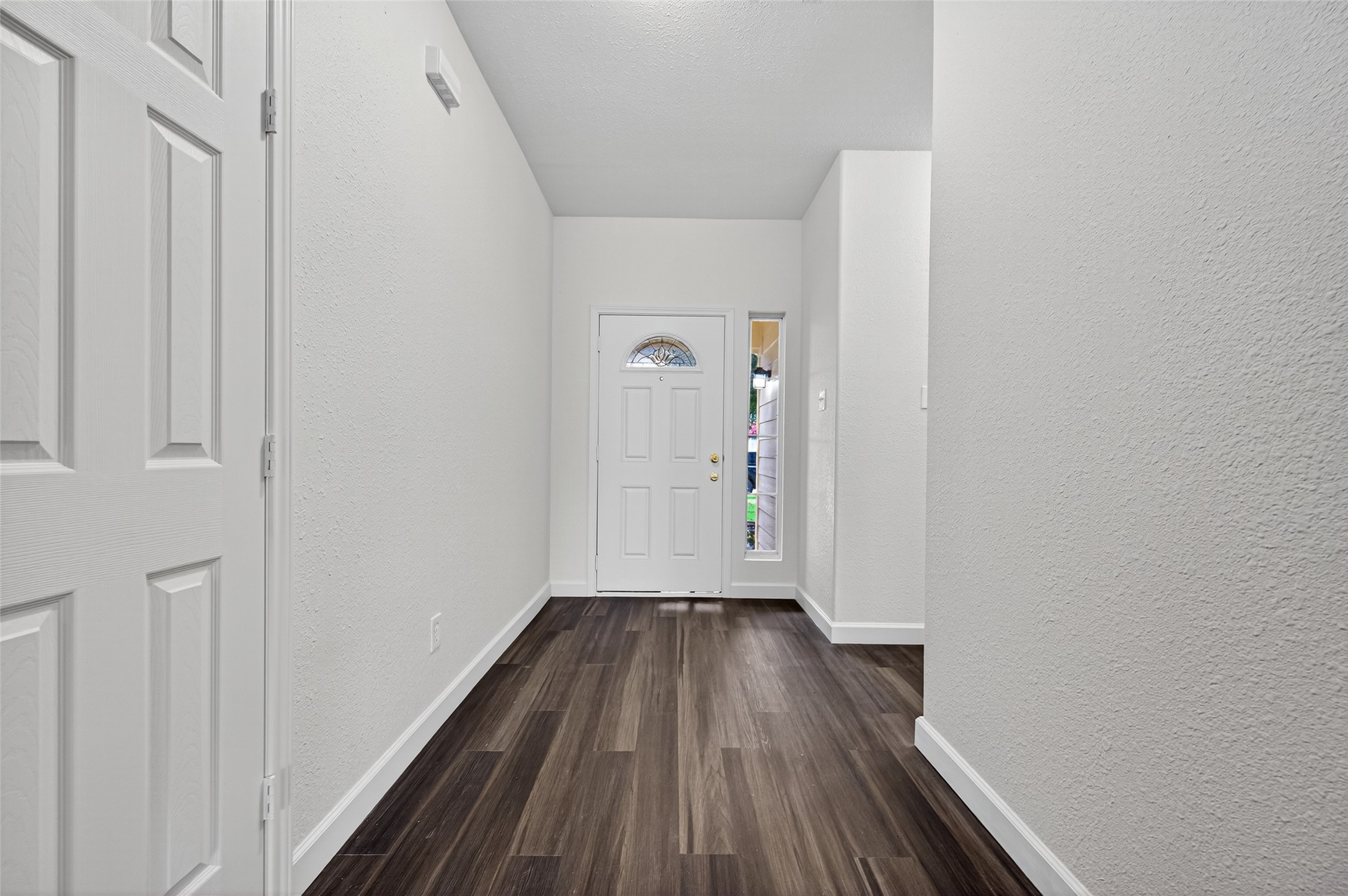3322 Brackenfern Road Katy, TX 77449 - Photo 8 of 38 a view of a hallway with wooden floor