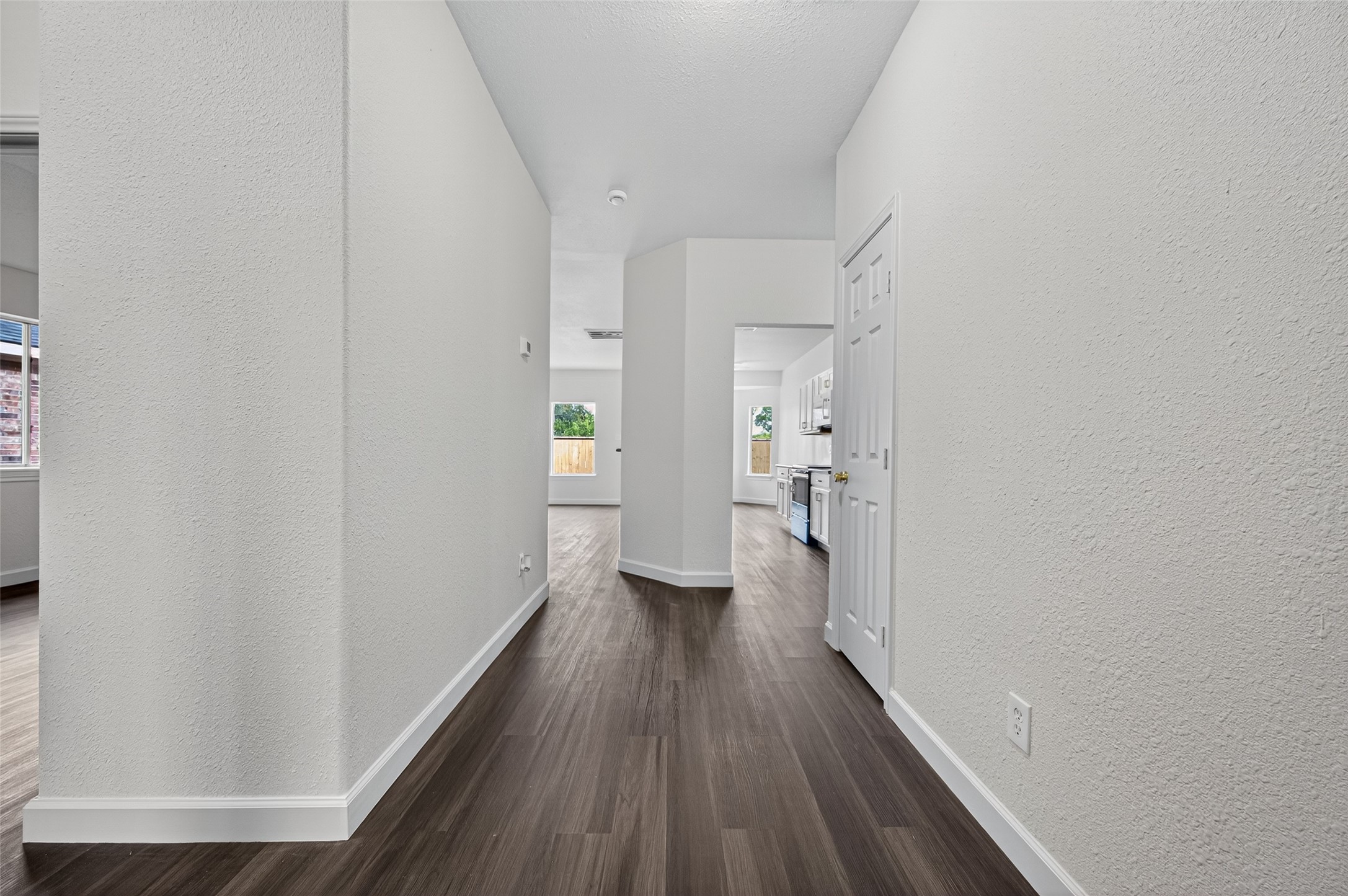 3322 Brackenfern Road Katy, TX 77449 - Photo 9 of 38 a view of a hallway with wooden floor