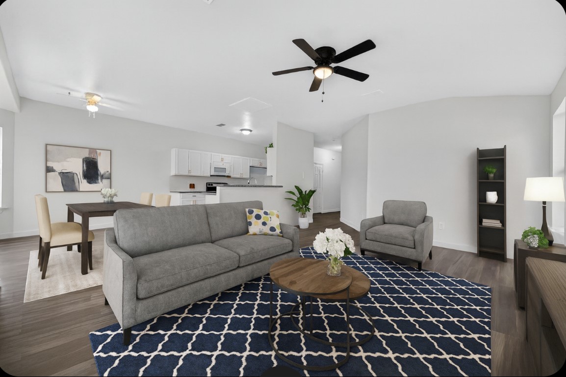 3322 Brackenfern Road Katy, TX 77449 - Photo 10 of 38 a living room with furniture and a rug