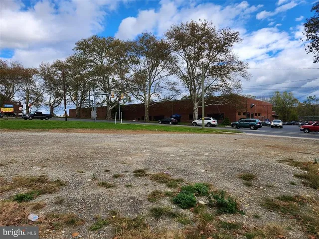 a view of a lake with houses in the back