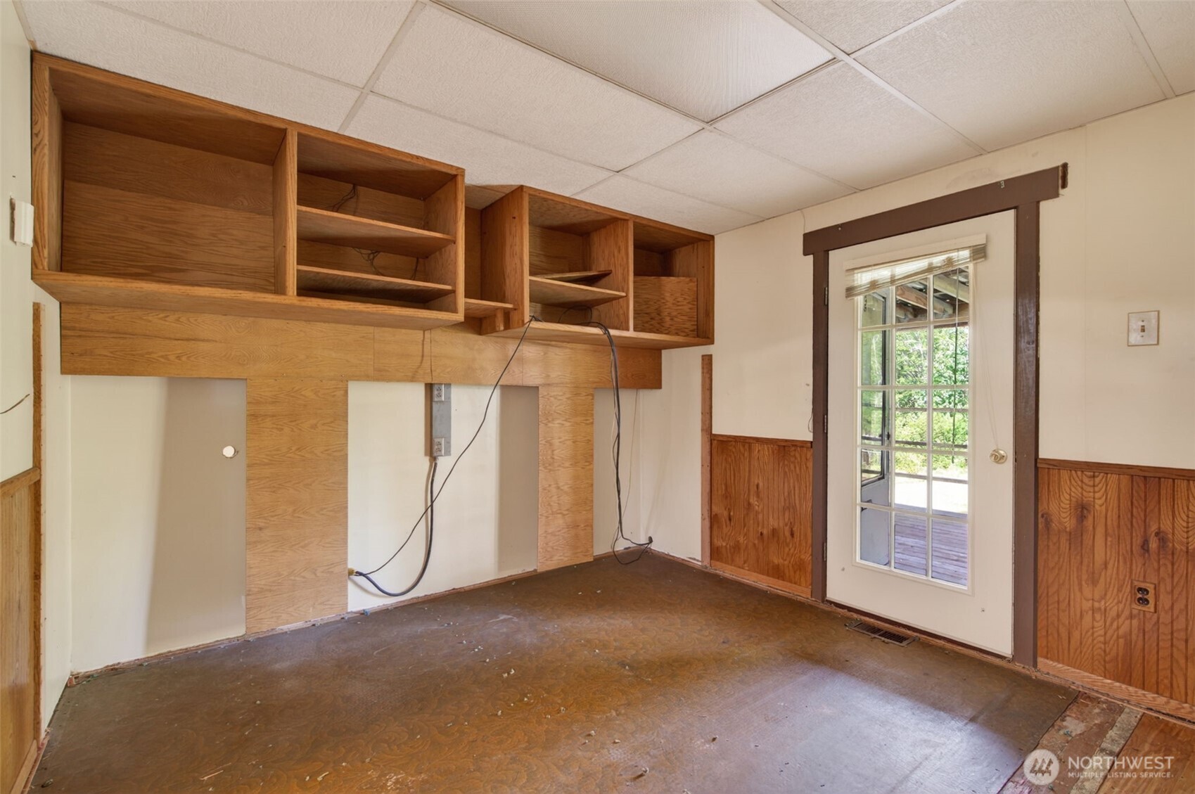 943 Fall Creek Road Longview, WA 98632 - Photo 11 of 40 a view of a room with wooden floor and windows