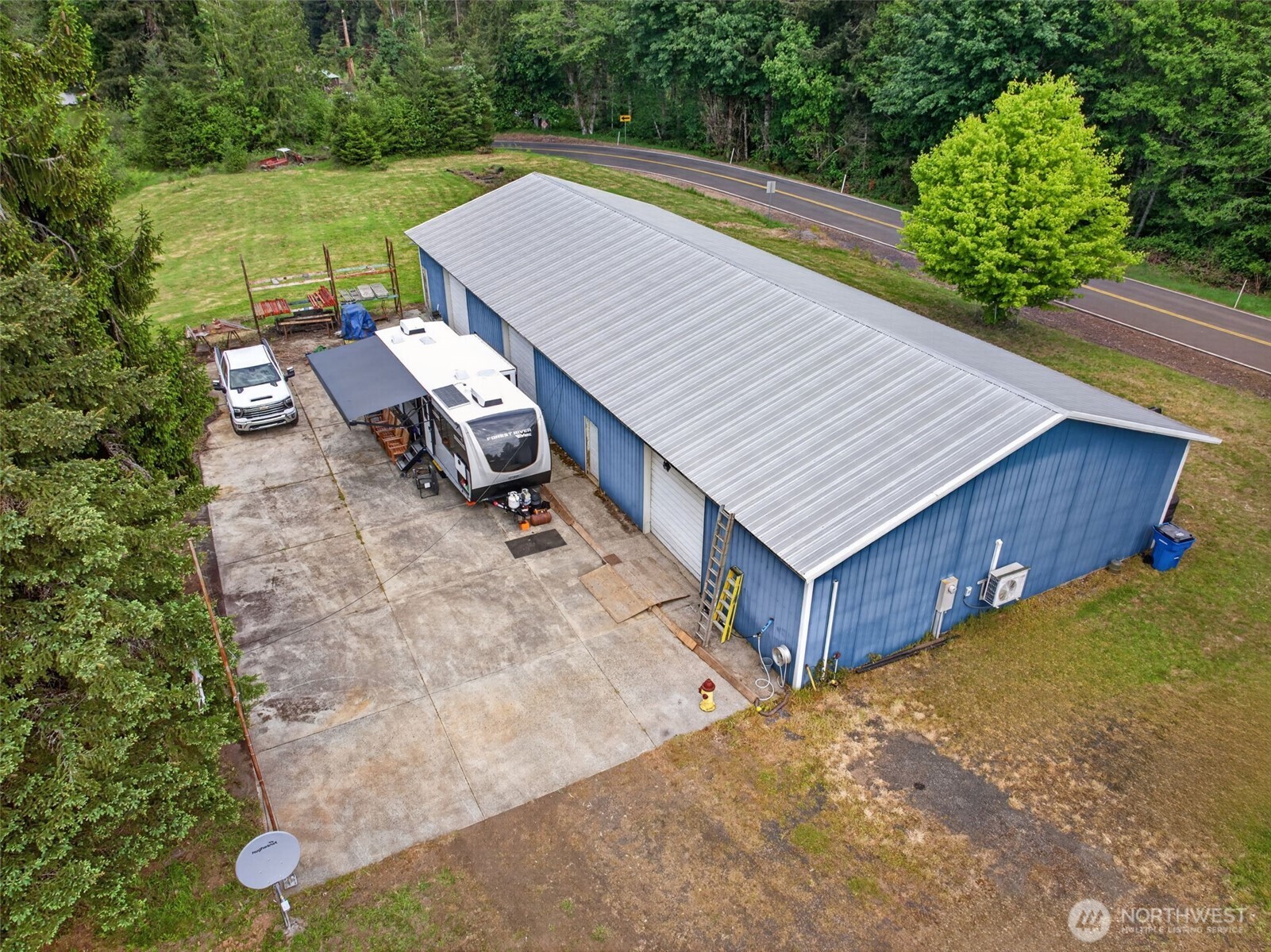 943 Fall Creek Road Longview, WA 98632 - Photo 17 of 40 a view of a wooden deck and a yard