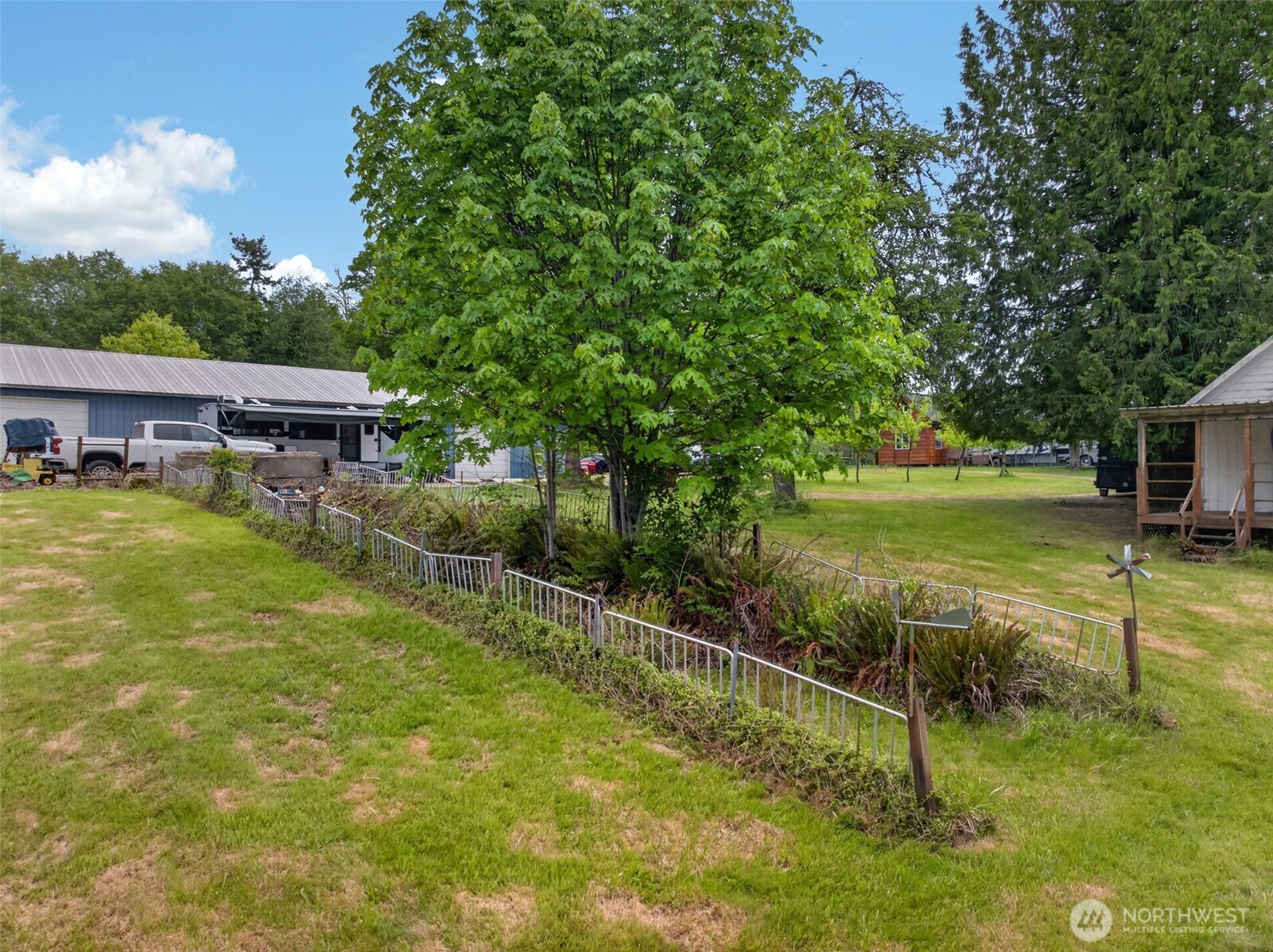 943 Fall Creek Road Longview, WA 98632 - Photo 31 of 40 a view of a swimming pool with a patio and a yard