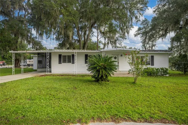 front view of a house with a yard