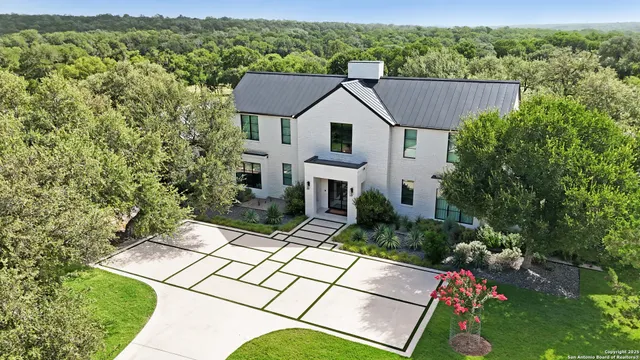 a aerial view of a house with a yard