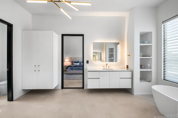 a room with furniture and a bathroom