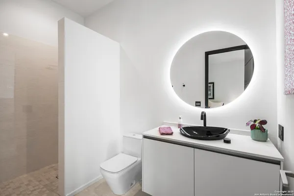 a bathroom with a toilet and a sink