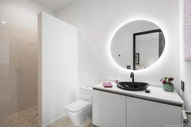 a bathroom with a toilet and a sink