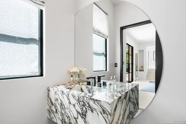 a view of a dining room with furniture and a window