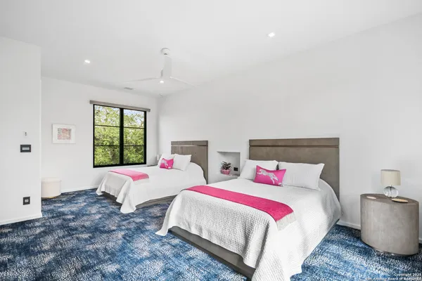 a bedroom with bed and window