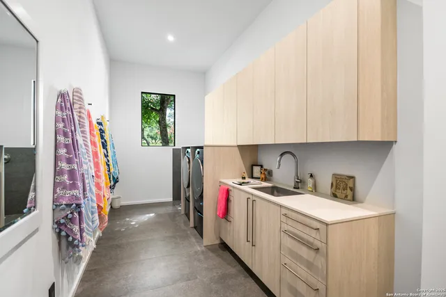 a view of storage and utility room with utility room