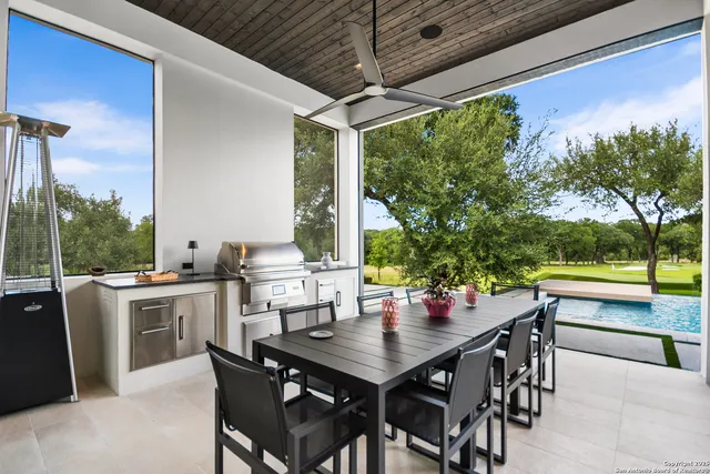 a view of an outside dining space with furniture