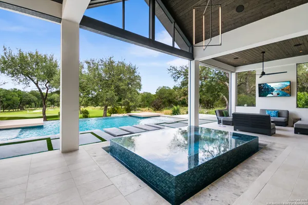 a view of swimming pool with patio