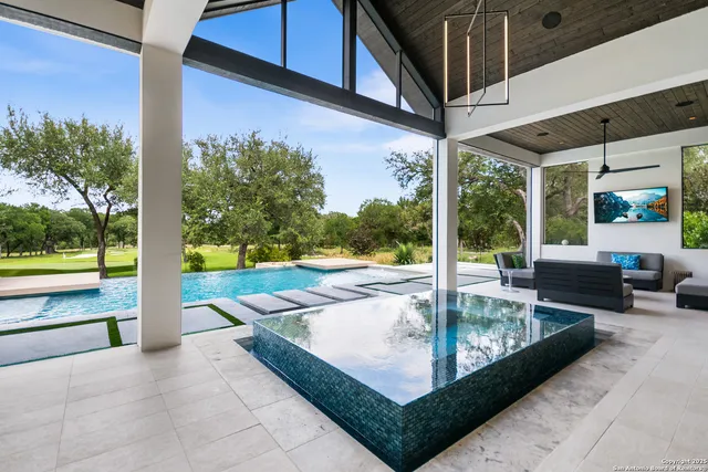 a view of swimming pool with patio