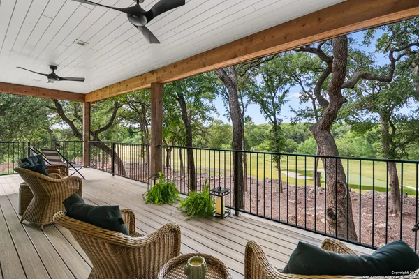 a view of balcony with furniture