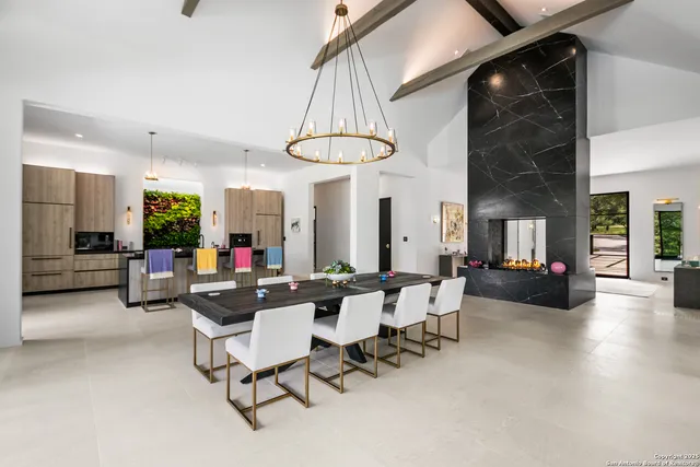 a living room with furniture a couch and dresser