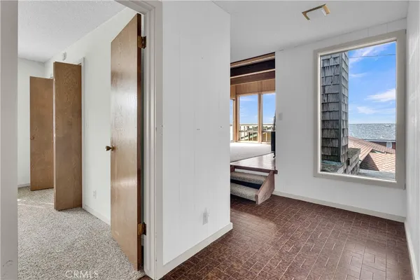 a view of livingroom with furniture and windows