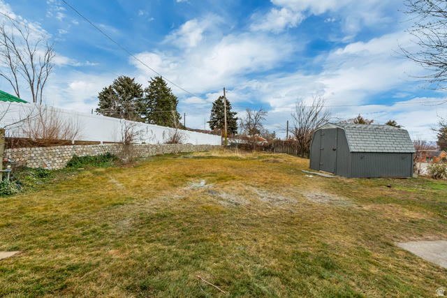 337 West 2900th Street South Bountiful, UT 84010 - Photo 34 of 35 Fenced backyard with a shed