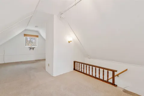 a view of a big room with closet and windows