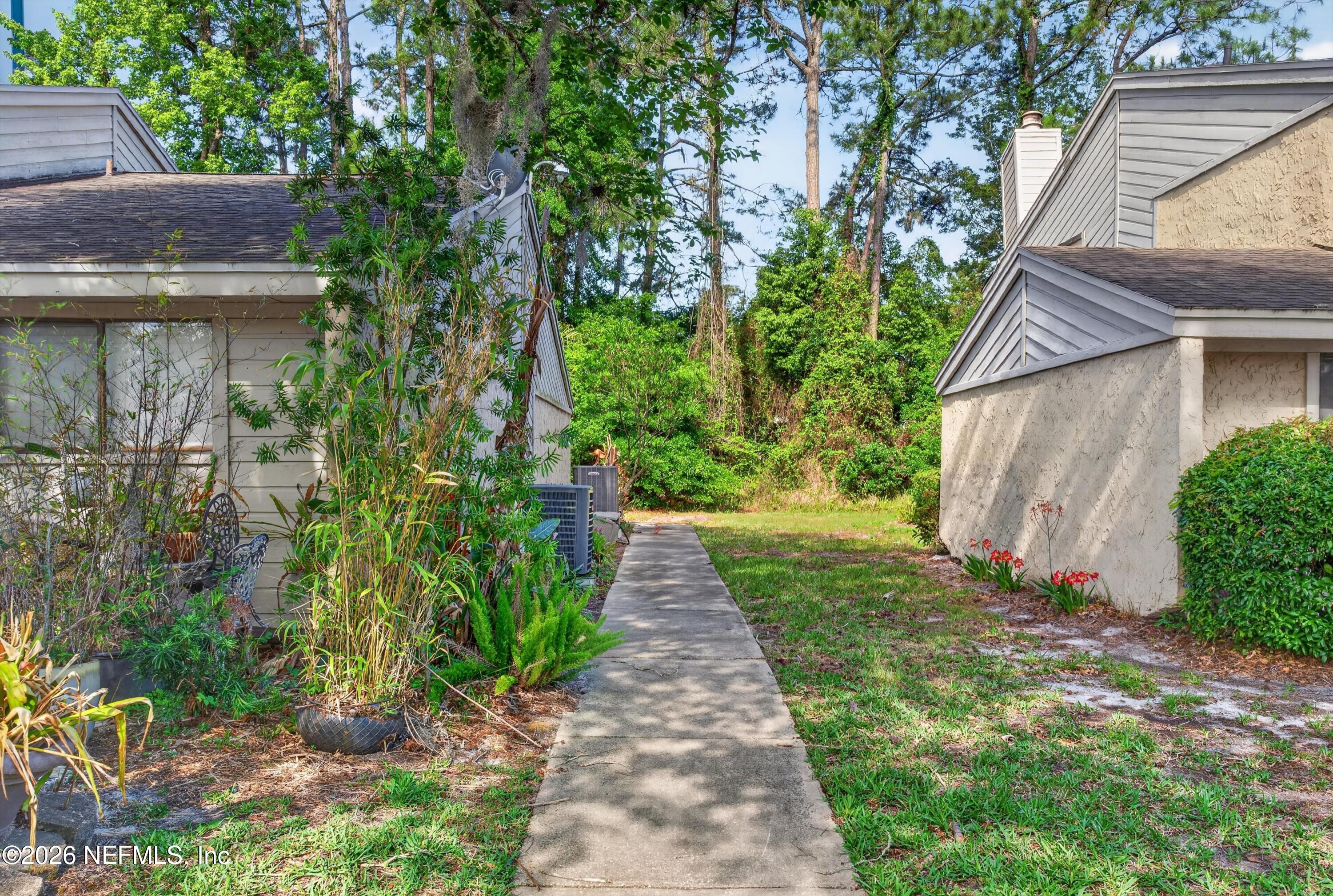 3801 Crown Point Road, Unit 1294 Jacksonville, FL 32257 - Photo 20 of 21 a view of a pathway both side of the house