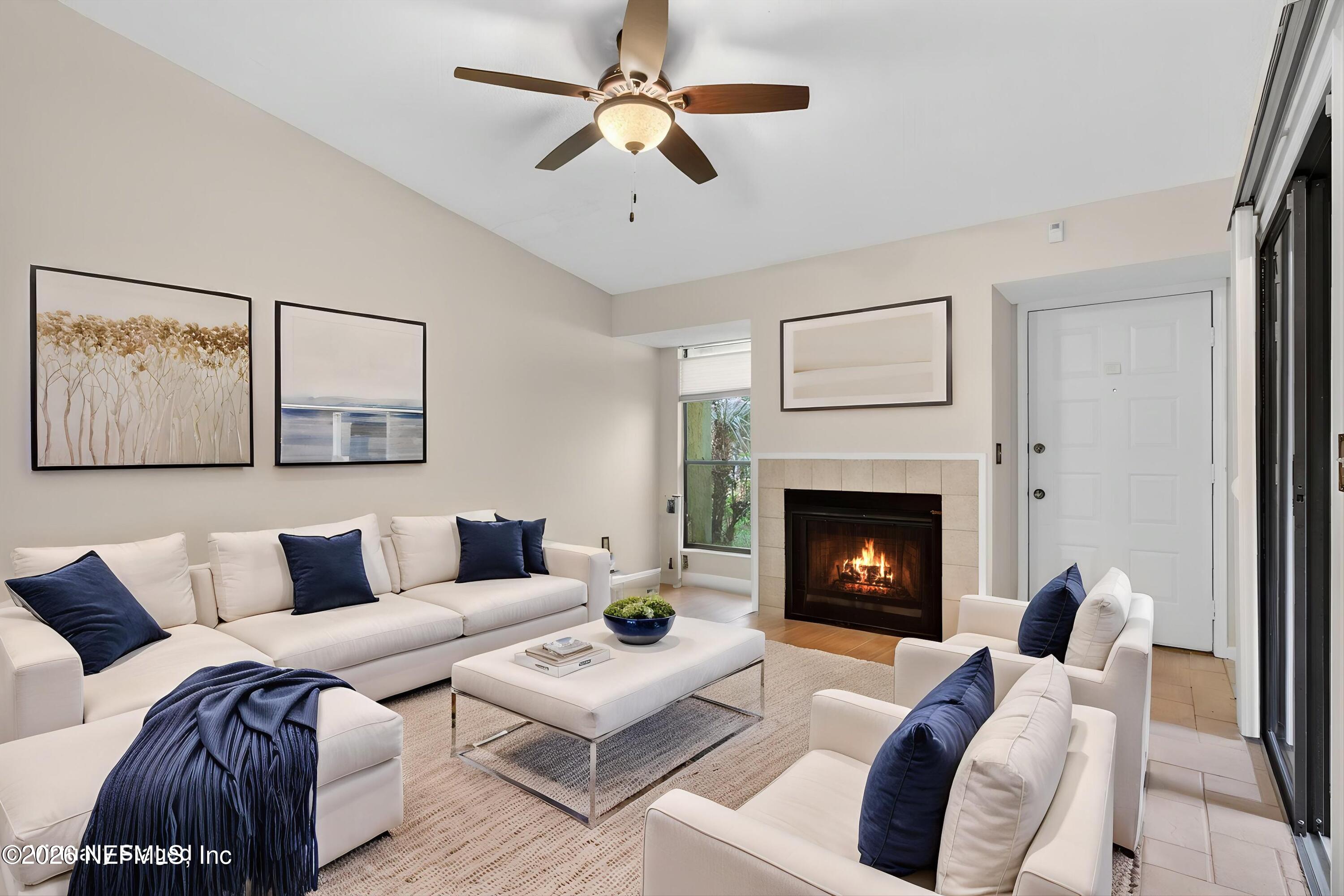 3801 Crown Point Road, Unit 1294 Jacksonville, FL 32257 - Photo 4 of 21 a living room with furniture and a fireplace