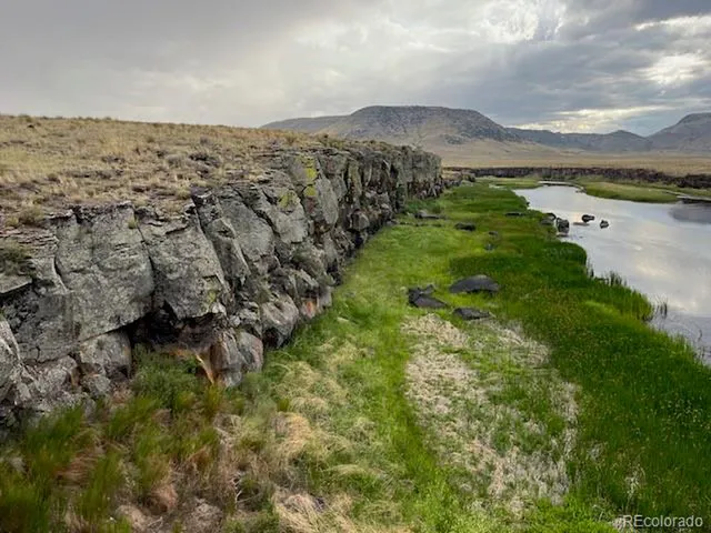 a view of a lake with mountains in the background