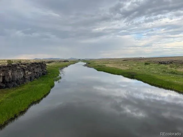 a view of a lake with a big yard