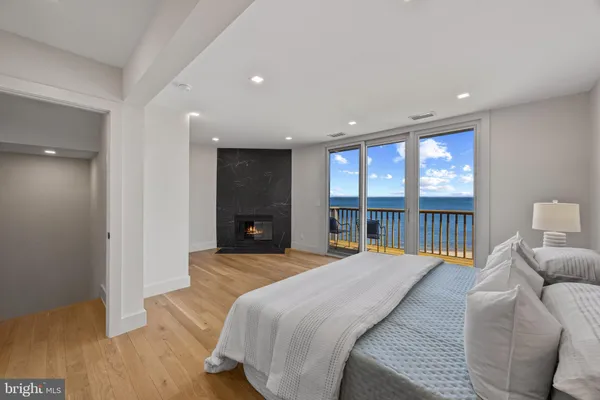 a spacious bedroom with a bed and a large window