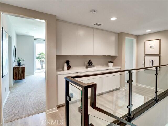 706 Obsidian Loop East Palm Springs, CA 92264 - Photo 18 of 49 a view of entryway with wooden floor and furniture