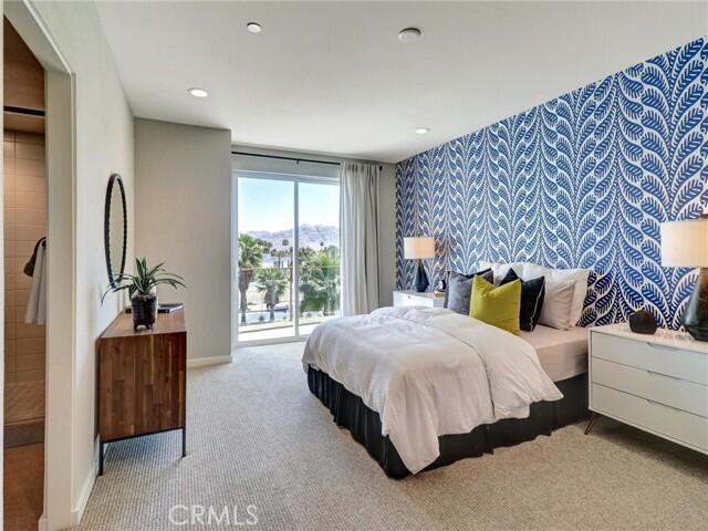 706 Obsidian Loop East Palm Springs, CA 92264 - Photo 19 of 49 a bedroom with a bed and a large window