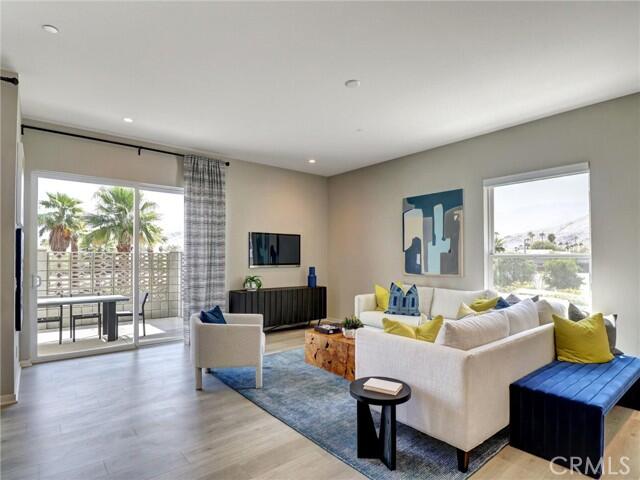 706 Obsidian Loop East Palm Springs, CA 92264 - Photo 2 of 49 a living room with furniture and a flat screen tv