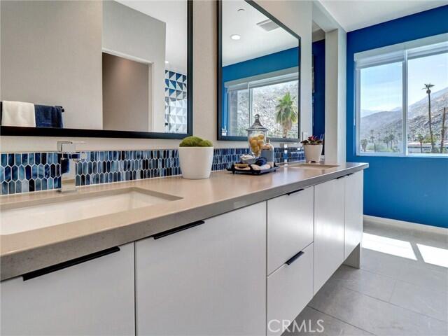 706 Obsidian Loop East Palm Springs, CA 92264 - Photo 29 of 49 a kitchen with counter top space and windows