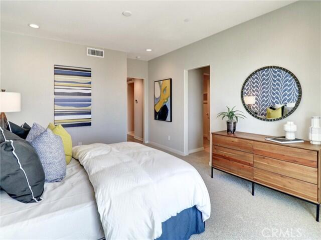 706 Obsidian Loop East Palm Springs, CA 92264 - Photo 33 of 49 a bed room with a bed and a painting
