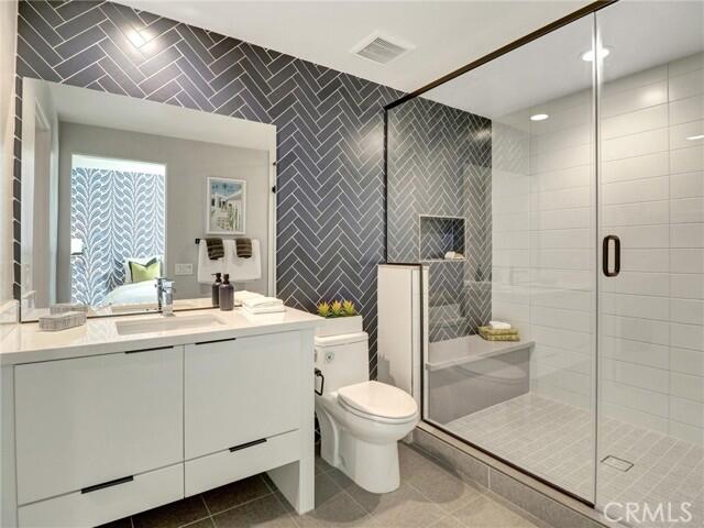 706 Obsidian Loop East Palm Springs, CA 92264 - Photo 37 of 49 a bathroom with a sink toilet and shower