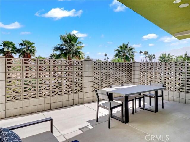 706 Obsidian Loop East Palm Springs, CA 92264 - Photo 40 of 49 a view of a terrace with furniture and potted plants