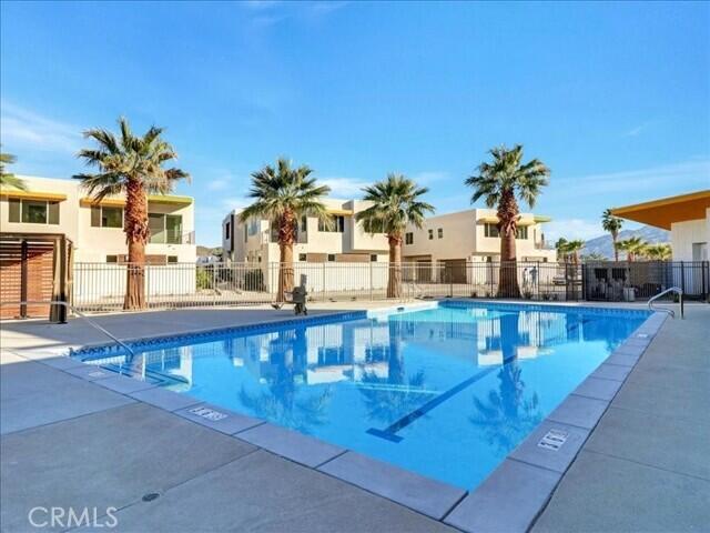 706 Obsidian Loop East Palm Springs, CA 92264 - Photo 43 of 49 a large swimming pool with outdoor seating