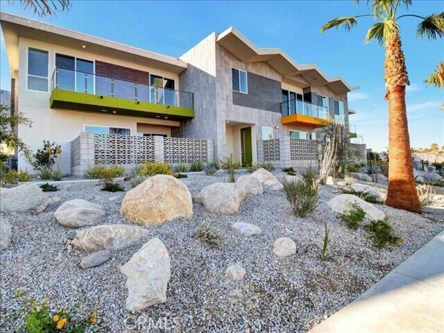 706 Obsidian Loop East Palm Springs, CA 92264 - Photo 45 of 49 a front view of a house with a yard