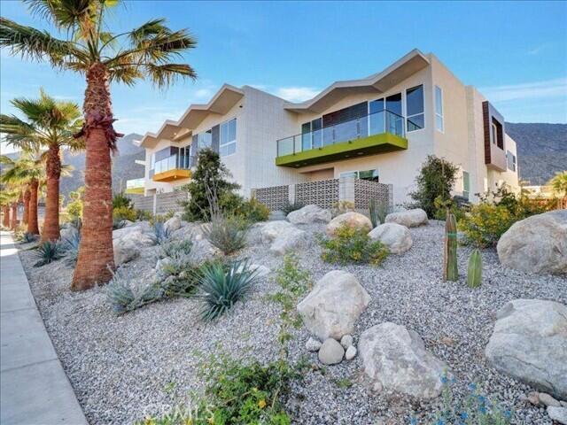 706 Obsidian Loop East Palm Springs, CA 92264 - Photo 48 of 49 a front view of a house with a yard